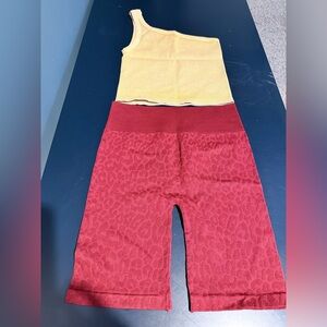 Tiger Friday dance wear set. Maroon biker shorts. Gold one shoulder tank.